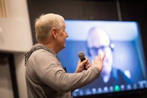 ELCA North Carolina Synod Bishop Tim Smith asks a question with the large Zoom screen visible in background