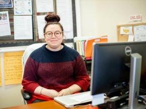 Yasmine Arevalo at her desk in the career center