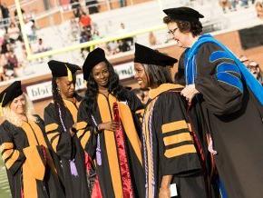 Kerry Thompson places academic hoods on DNP graduates at 2024 commencement